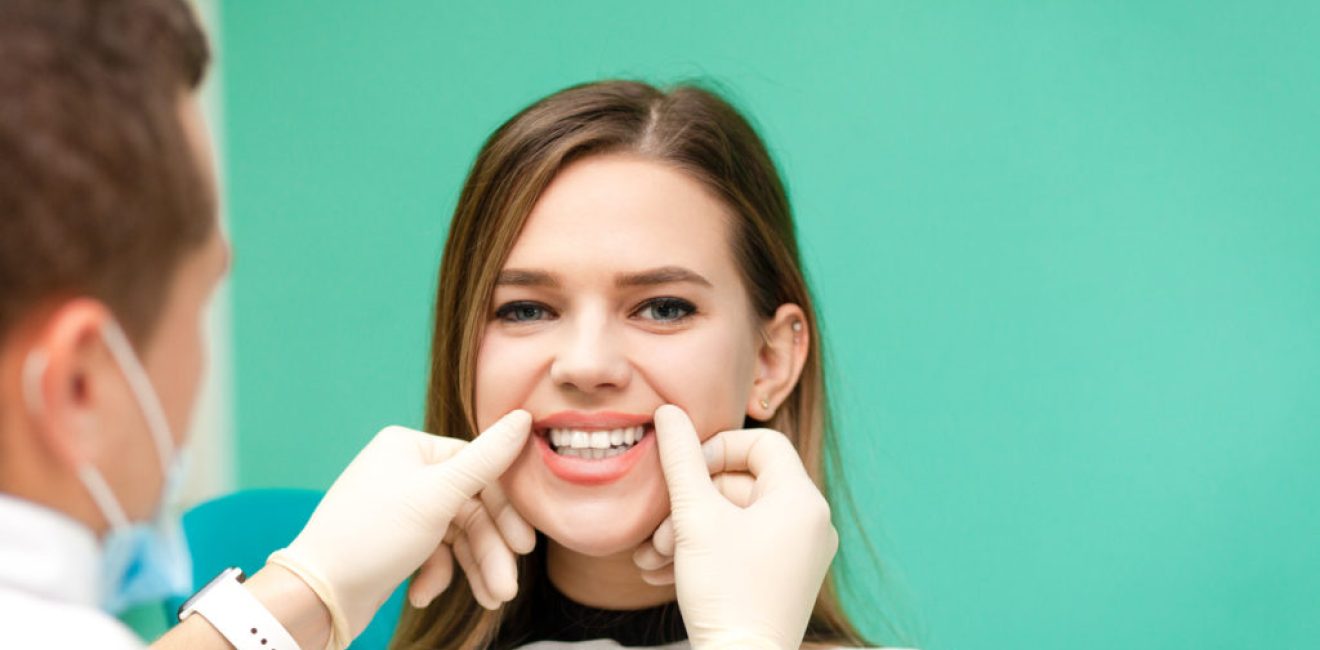 Young girl at the dentist's appointment. Dentist checks a girl’s teeth