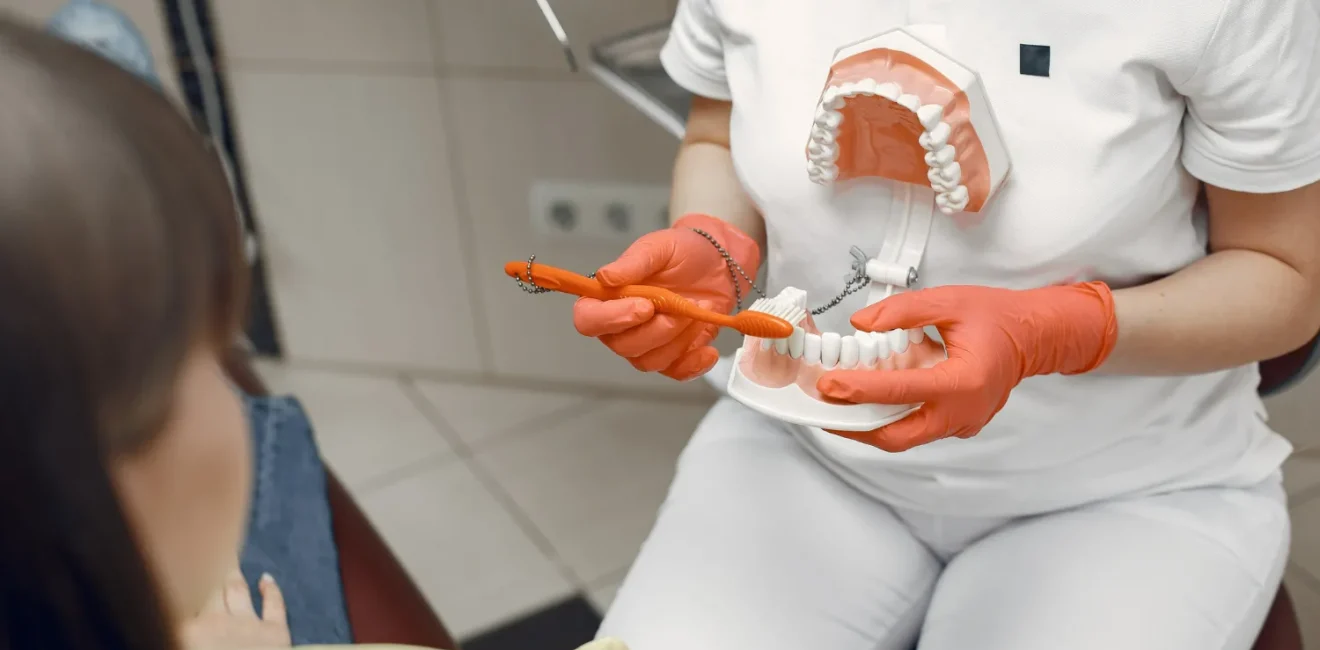 woman-dental-chair-dentist-teaches-proper-care-beauty-treats-her-teeth